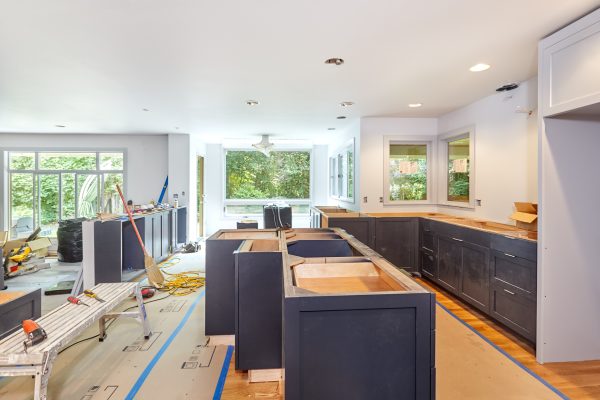 Installation of custom kitchen cabinets and island in progress